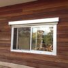 Acmeda Vue External Wire Guide blind installed over a sliding window