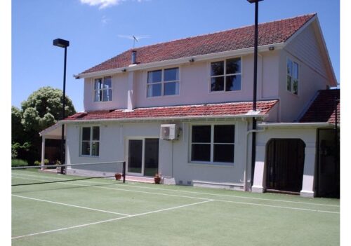 Two-storey home with window awnings