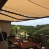 beige retractable folding arm awning