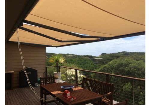 beige retractable folding arm awning