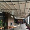 rooftop bar terrace equipped with a retractable pergola roof system