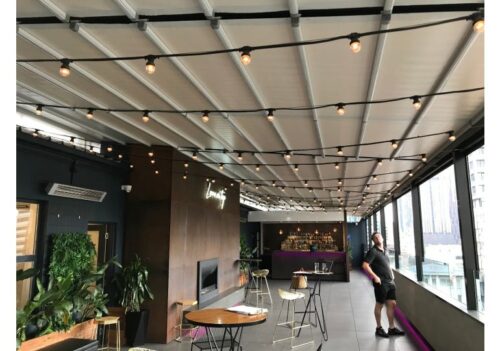 rooftop bar terrace equipped with a retractable pergola roof system