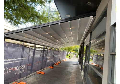 Retractable Shade commercial awning over outdoor walkway